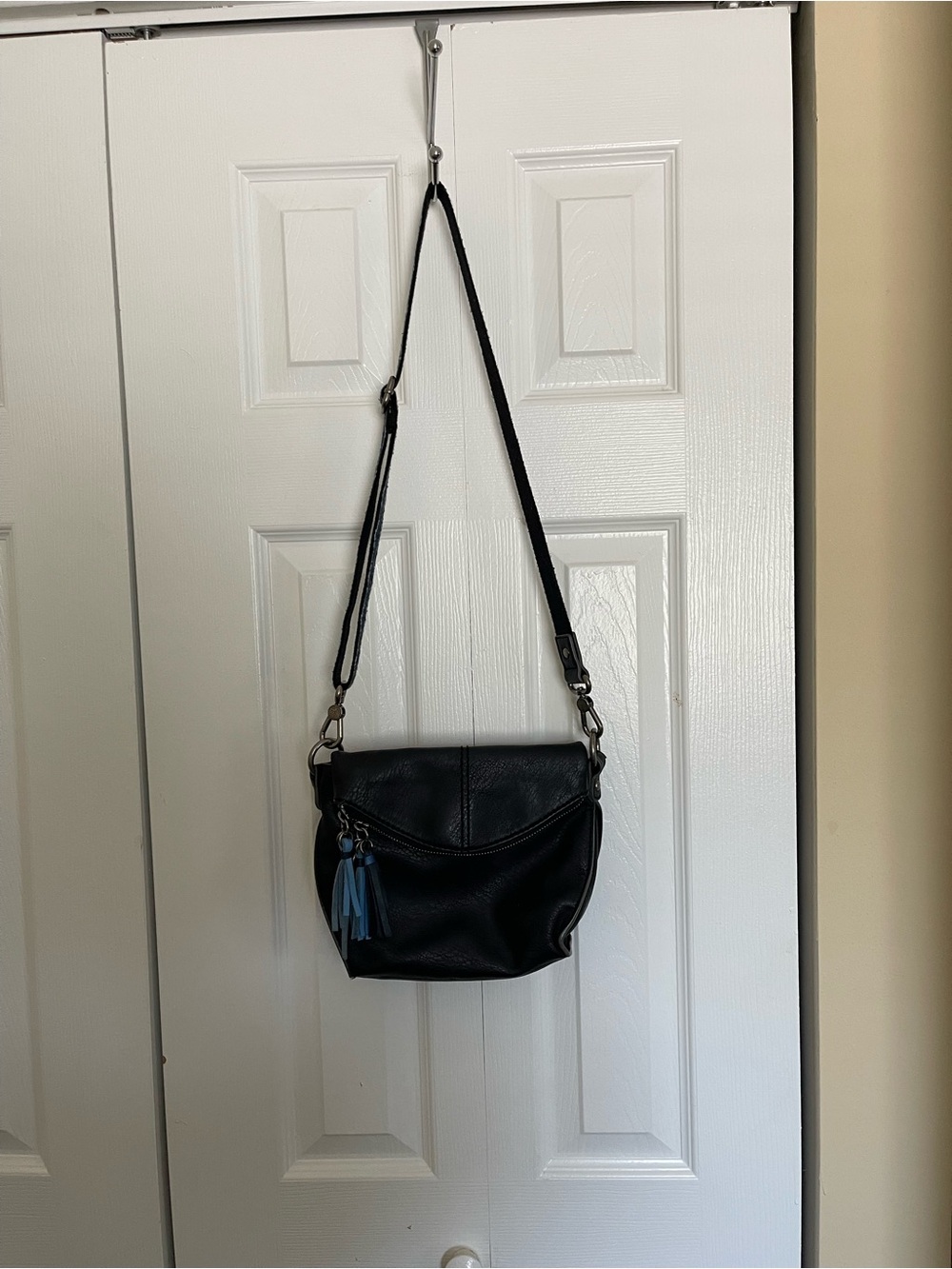 The Sak Black Leather Crossbody Bag with Blue Tassel